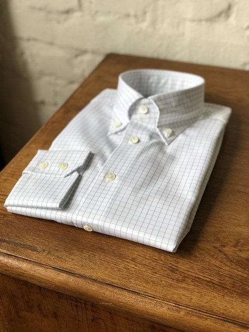 white button-down shirt with blue check
