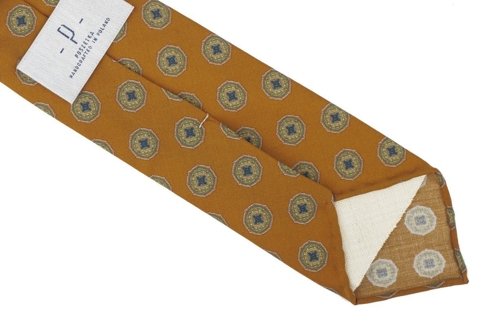Pomarańczowy krawat w medaliony bez podszewki z wełny drukowanej